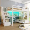 A child's loft bed with a desk, shelves, and storage stairs, set up in a bedroom. Produktbild-Vorschau