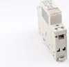A close-up, angled view of a white electrical relay on a white background. Náhľad obrázku produktu