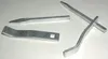 Four metal tools are arranged on a white surface. Náhľad obrázku produktu