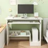 A white computer desk with a monitor, keyboard, and storage shelves, set against a light green wall. Produktbild-Vorschau