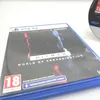 A PlayStation 5 game case for Hitman World of Assassination, with a disc visible in the background. Náhľad obrázku produktu