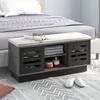 A shoe bench with storage is placed in front of a bed in a bedroom setting. Anteprima dell’immagine prodotto