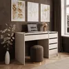 A modern desk setup with a laptop, lamp, and artwork on a dark wall. Produktbild-Vorschau