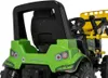 Close-up rear view of a green toy tractor with a black seat and yellow loader. Produktbild-Vorschau