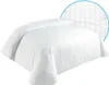 A white duvet cover with subtle vertical stripes is shown on a bed. A circular inset highlights a close-up of the fabric's texture and pattern. Produktbild-Vorschau