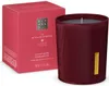 A red box and a burgundy scented candle are displayed side-by-side against a white background. Produktbild-Vorschau