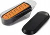 A kitchen grater with a clear container and an orange grating surface, next to its black lid. Náhled obrázku produktu