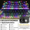 A string of colorful net lights draped over a bench in an outdoor setting. Produktbild-Vorschau