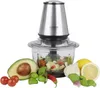 A food chopper with ingredients like avocado, tomatoes, basil, garlic, lemon, and chili peppers arranged around it. Produktbild-Vorschau