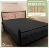 A dark gray fitted sheet is shown on a black metal bed frame with an ornate headboard. Produktbild-Vorschau