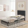 A bedroom scene with a bed, rug, and artwork. Náhled obrázku produktu