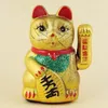 A golden Maneki-neko (lucky cat) figurine. Produktbild-Vorschau