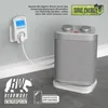 A white smart plug timer is plugged into a wall socket, connected by a white cord to a silver and white portable heater. The scene is set against a light gray wall and a gray tiled floor. Náhľad obrázku produktu