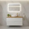 A modern bathroom vanity with a sink and faucet, set against a marble-tiled wall. Produktbild-Vorschau