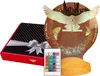 A gift-wrapped box, a remote control, and a Harry Potter-themed night light with an owl. Produktbild-Vorschau