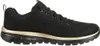 A side view of a black and gold Skechers sneaker. Produktbild-Vorschau