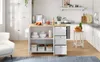 A kitchen scene with a kitchen island cart, cabinets, and a countertop. Podgląd zdjęcia produktu