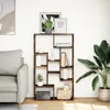 A living room scene with a bookshelf, sofa, and plant. Náhled obrázku produktu