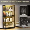 A black glass display cabinet with LED lighting, showcasing books and bottles on its shelves. Two comparison images are shown on the right, illustrating glass breakage. Náhled obrázku produktu