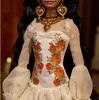 Close-up of a Barbie doll dressed in a traditional outfit, adorned with jewelry. Náhled obrázku produktu
