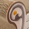 Close-up of a cat scratching post with a decorative element and a small orange plastic piece. Voir les images du produit