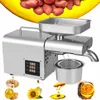 A collage of an oil press machine with various ingredients and oil products. Podgląd zdjęcia produktu