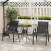 A patio set with two chairs and a table on a rug, with plants and a fence in the background. Náhled obrázku produktu