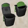 Two black trash bins with green lids are shown from different angles against a light gray background. Náhľad obrázku produktu
