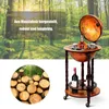 A wooden globe bar cart with bottles of wine and glasses, set against a backdrop of a sunlit forest. Náhled obrázku produktu