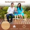 A family is sitting on a wooden garden bench outdoors, surrounded by greenery. Anteprima dell’immagine prodotto