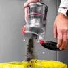 A person is emptying a vacuum cleaner dustbin into a yellow trash bag. Voir les images du produit
