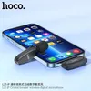 A black HOCO wireless lavalier microphone is shown connected to a smartphone. Anteprima dell’immagine prodotto