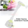 A person wearing pink gloves is washing lettuce in a sink, with a water-saving faucet extension in the foreground. Produktbild-Vorschau