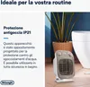 A bathroom heater is shown next to a toilet and a plant, highlighting its water-resistant features. Voir les images du produit