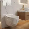 A modern bathroom with a wall-mounted toilet and a wooden vanity. Podgląd zdjęcia produktu