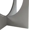 A close-up view of a modern, minimalist table base with curved elements. Produktbild-Vorschau