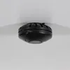 A black smoke detector is mounted on a white ceiling. Voir les images du produit