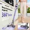 A person is using a cordless vacuum cleaner in a modern kitchen or living area. The image includes text overlays highlighting product features. Voir les images du produit