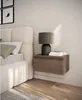 A bedroom scene with a bed, nightstand, and lamp. Produktbild-Vorschau