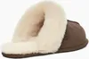 A single UGG slipper shown from a side-diagonal angle on a white background. Náhled obrázku produktu