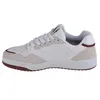 A side view of a white and beige sneaker with red accents. Anteprima dell’immagine prodotto