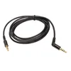 A black audio cable with gold-plated connectors is coiled on a white background. Náhled obrázku produktu