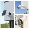 Collage of images showing a white wireless security camera with a solar panel attached, mounted on a building exterior, and also showing close-ups of the camera. Produktbild-Vorschau