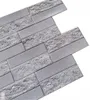A close-up, angled view of several interlocking 3D PVC wall panels designed to imitate stone and wood. Náhľad obrázku produktu