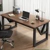 A desk with a laptop, lamp, and chair in a home office setting. Náhľad obrázku produktu