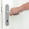 A hand is shown operating a door handle. Anteprima dell’immagine prodotto