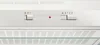 A close-up view of the control panel of a white range hood. Voir les images du produit