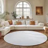 A living room scene with a sectional sofa, a round rug, and a large arched window. Produktbild-Vorschau