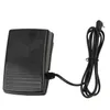 A black sewing machine foot pedal with a cord and plug, presented against a white background. Produktbild-Vorschau