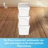 Three white buckets stacked on a wooden floor. Voir les images du produit